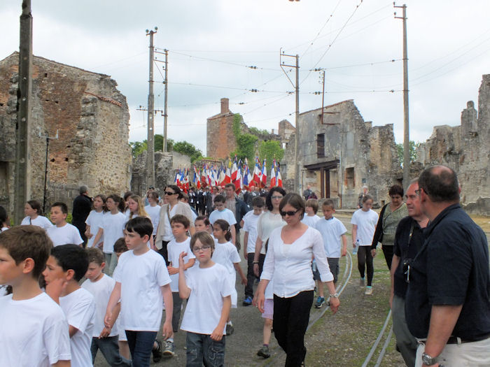 March through ruins near the church of Oradour-sur-Glane
