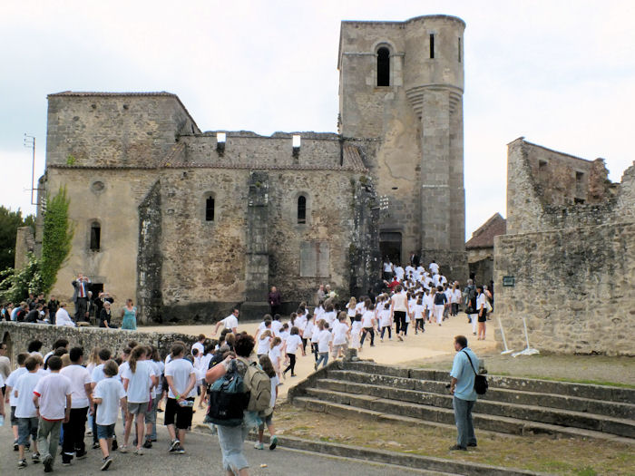 March going into the ruined church of Oradour-sur-Glane