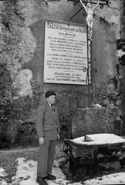 Roger Godfrin standing outside the church in Oradour