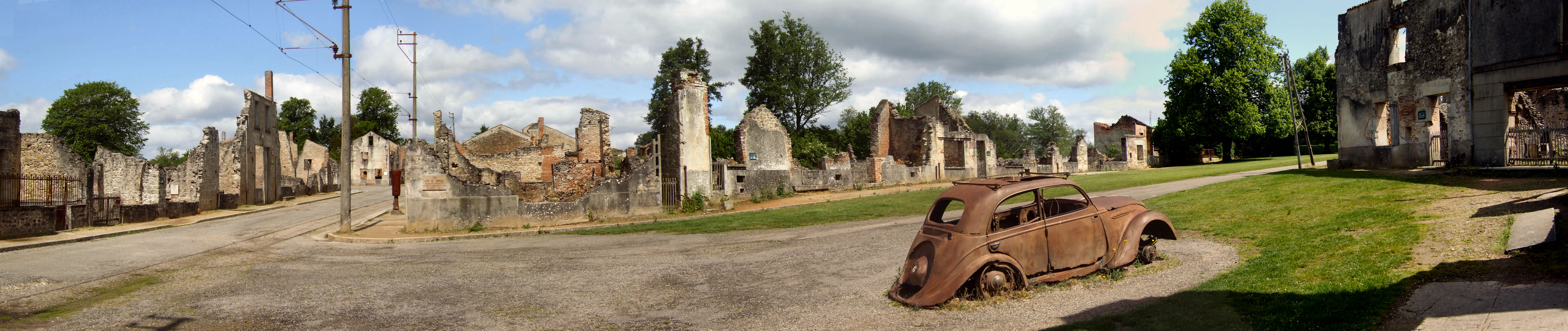 The Champ de Foire and the doctor's car at Oradour-sur-Glane looking north.