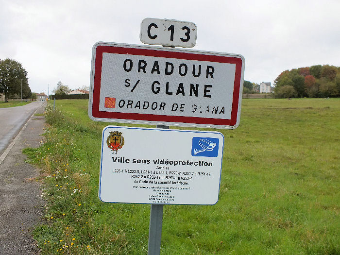 Road sign for Oradour in both French and Occitan on the C13